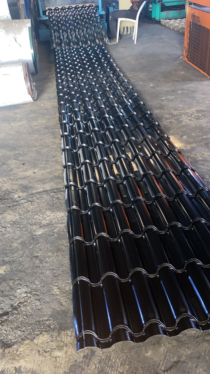 Glossy dark roofing sheets with a curved tile-style profile