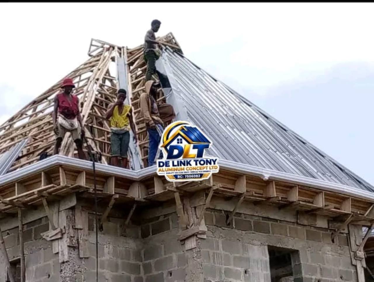 Roofing team installing silver long-span sheets