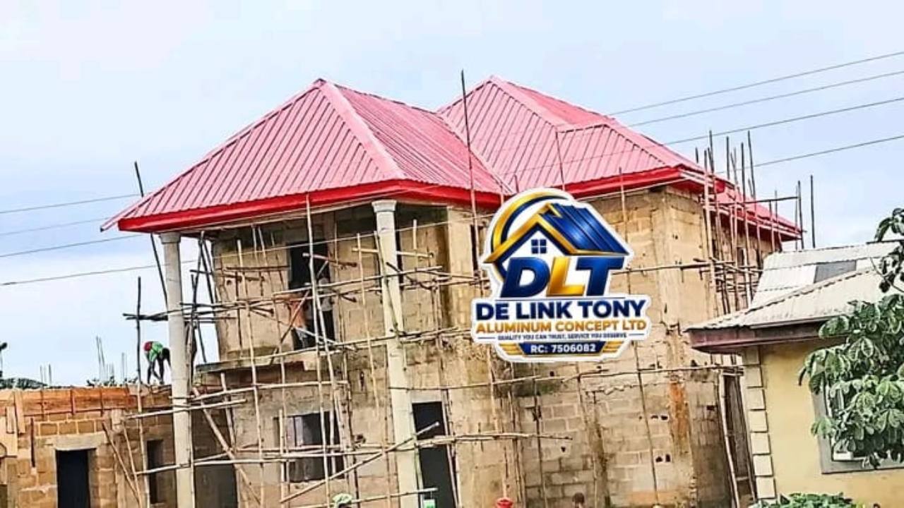 Pink long-span roof on a residential building under construction