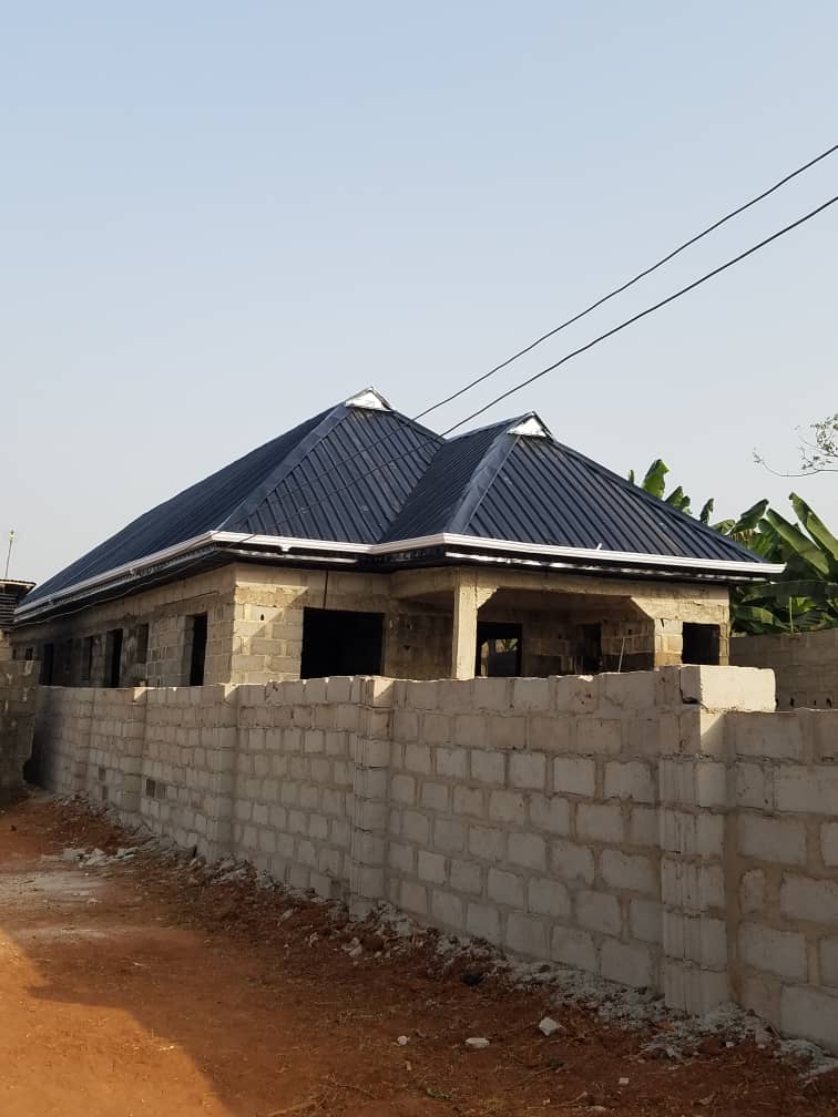 Dark straight-profile roof on a blockwork house